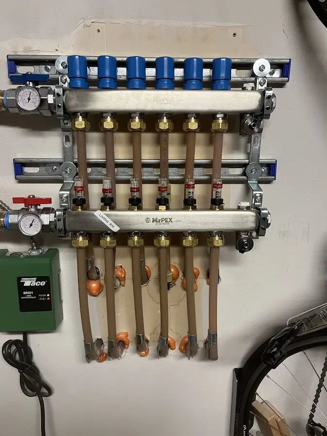 Plumber performing Water Heater Repair at a residential property in Louisville